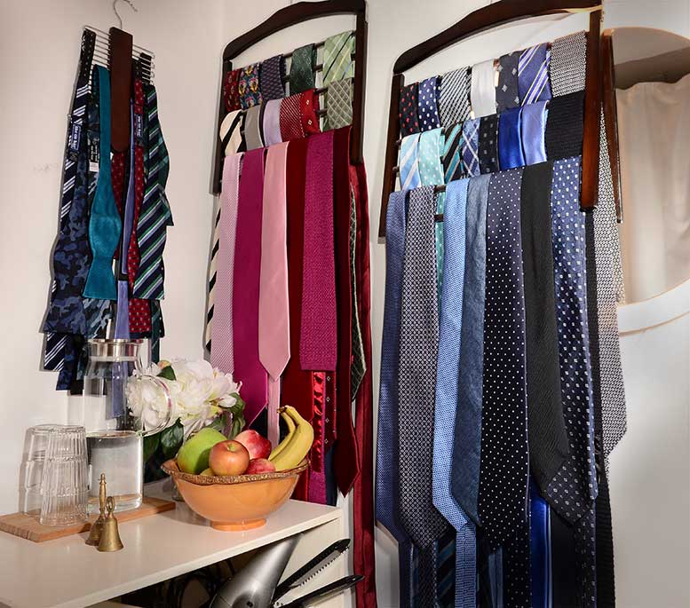 Jom's studio's rack of blue,other colours, and bow ties. You are most welcome to borrow them for no charge.
